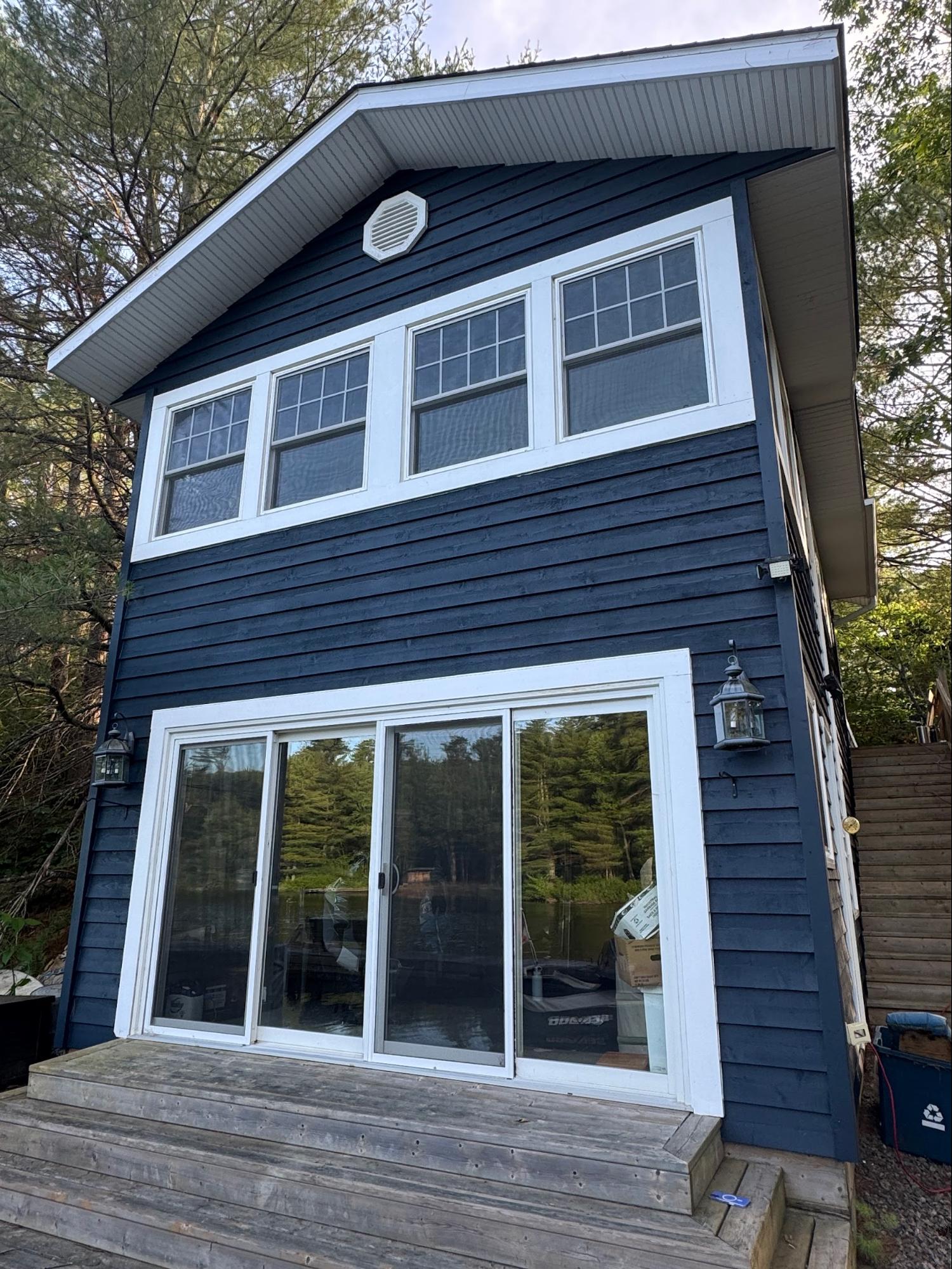 Two-story boathouse with exterior painting