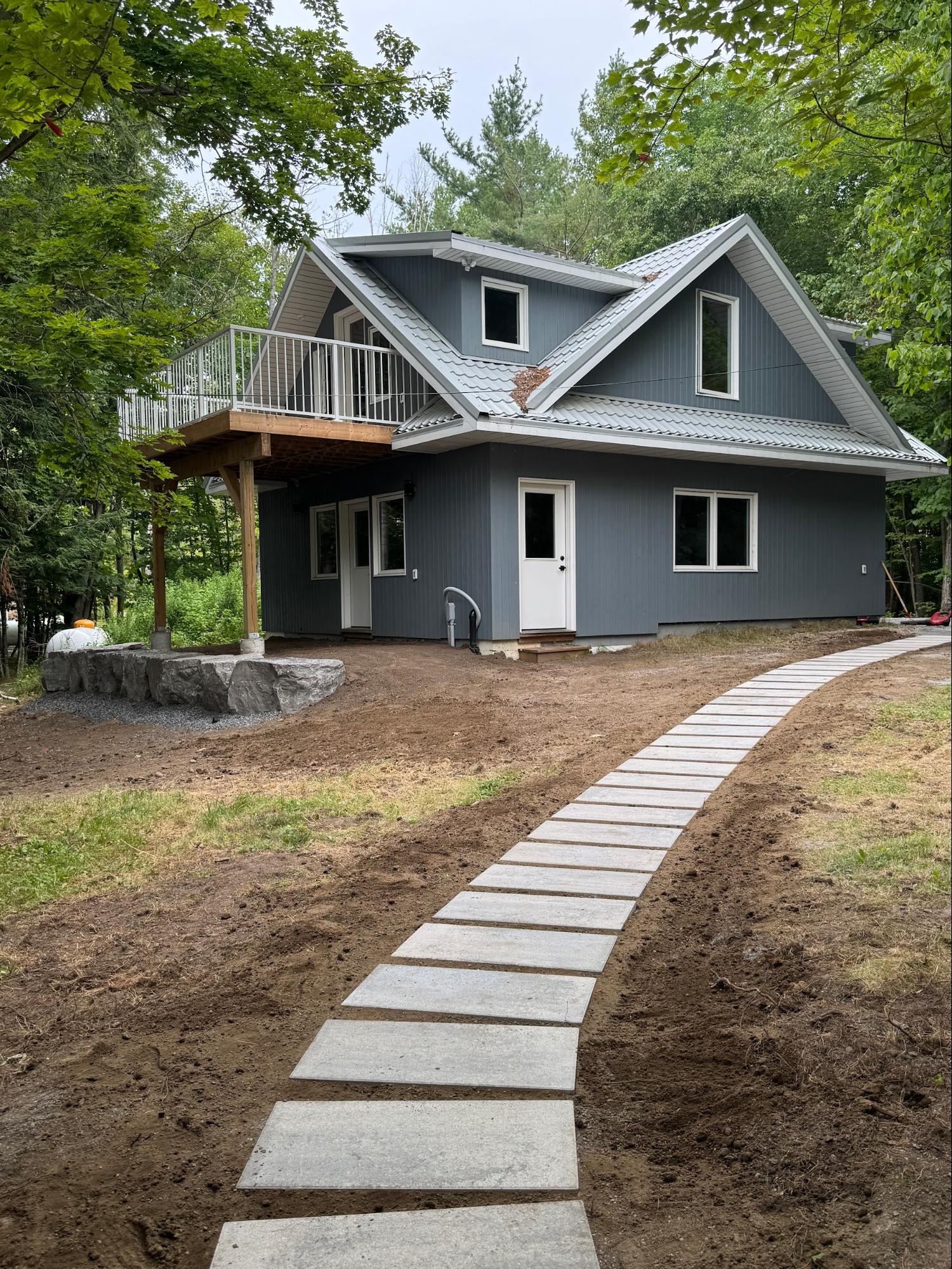 Paver walkway and boulder retaining wall